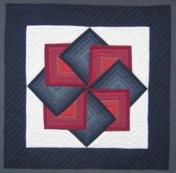 Custom Amish Quilts - Red Navy Spinning Star Small Quilt Wall Hanging