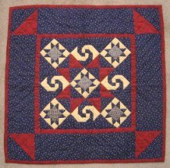 Custom Amish Quilts - Twirling Star Navy Red Small Quilt Wall Hanging