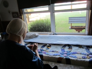 Anna Amish Quilter with Quilt