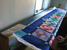 Amish Quilter - Amish Quilt in Frame Amish Quilter - Amish Quilt in Frame